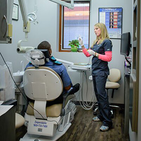 dental hygienist talking to patient