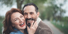 Laughing couple with dental implants in Roselle Park