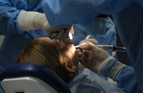 Woman getting oral surgery