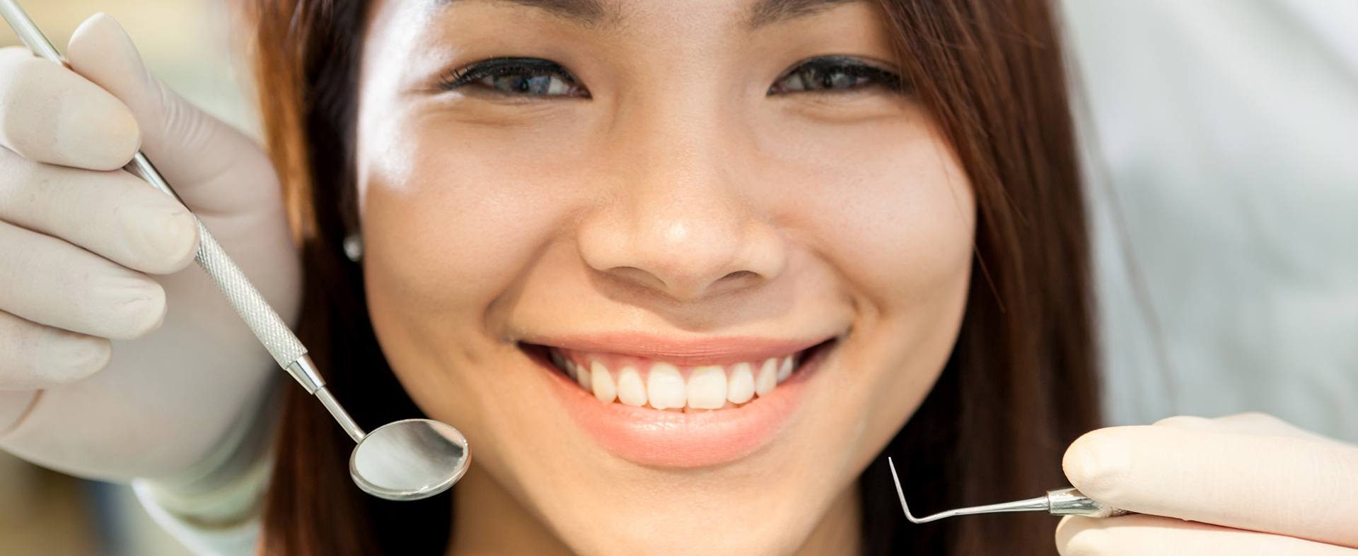 Patient in Roselle Park smiling after a complete smile makeover 