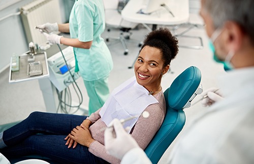 Woman seeing a dentist for a checkup