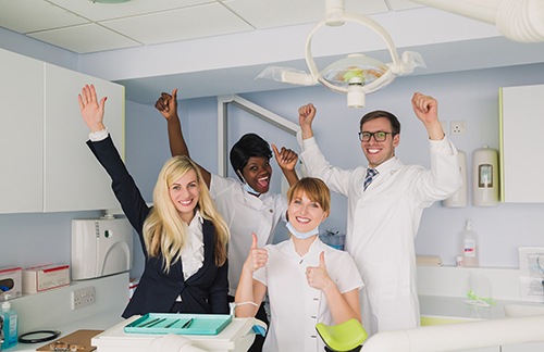Dental team happy and smiling