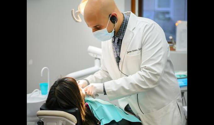 Dr. Oshinar working on patient's smile