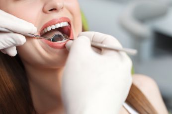 Female patient getting a dental exam 