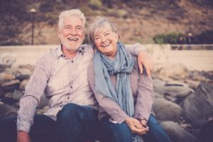 Older couple smiling with dental implants in Roselle Park