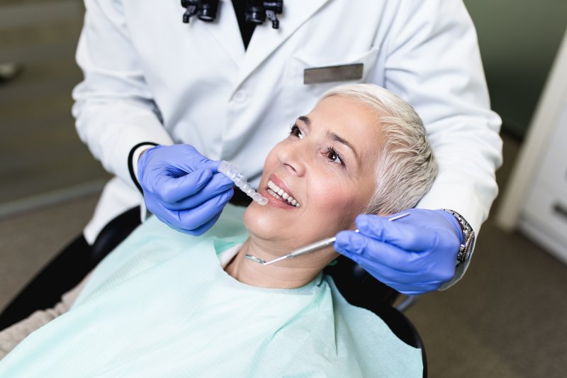 Senior woman receiving her first dental checkup of the year