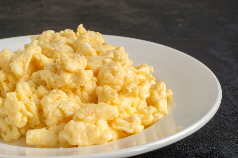 Scrambled eggs on a white plate