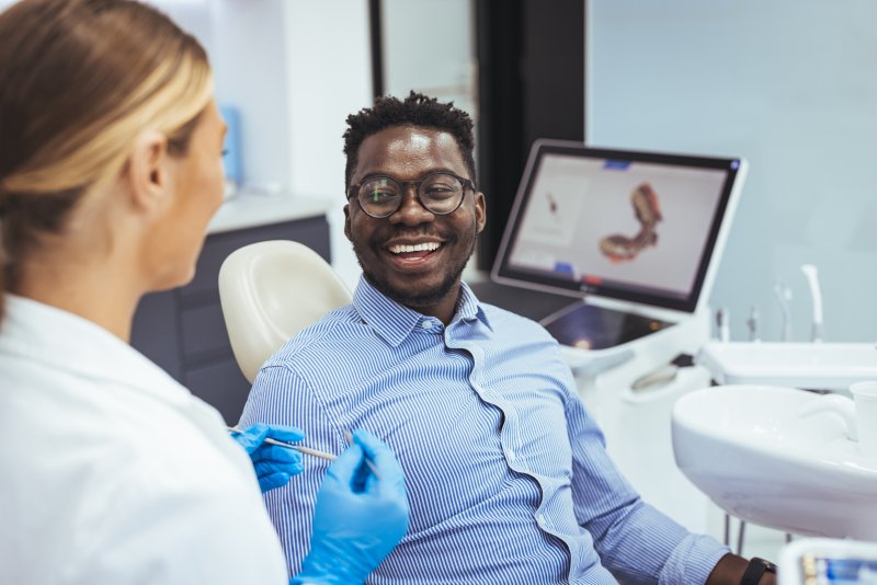 Patient talking to dentist about oral anatomy