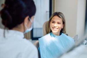 Woman talking to her dentist about cosmetic dentistry